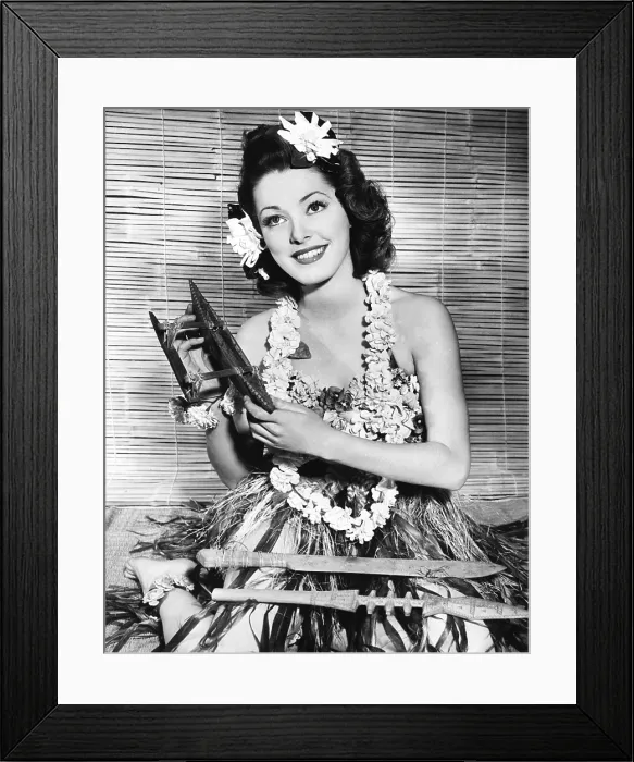 Framed Print : Eleanor Parker, wearing an outfit sent to her by her husband, Navy Lieutenant Fred Losee, who is stationed in the South Pacific, December 1943