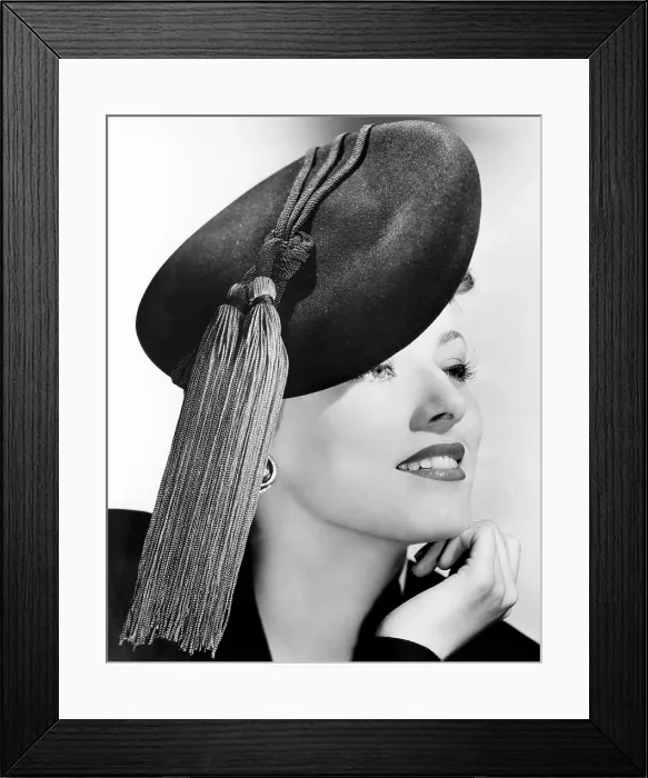 Framed Print : Eleanor Parker, modeling a black felt beret topped with bright red tassels, October 1943 Framed Print : Eleanor Parker, modeling a black felt beret topped with bright red tassels, October 1943