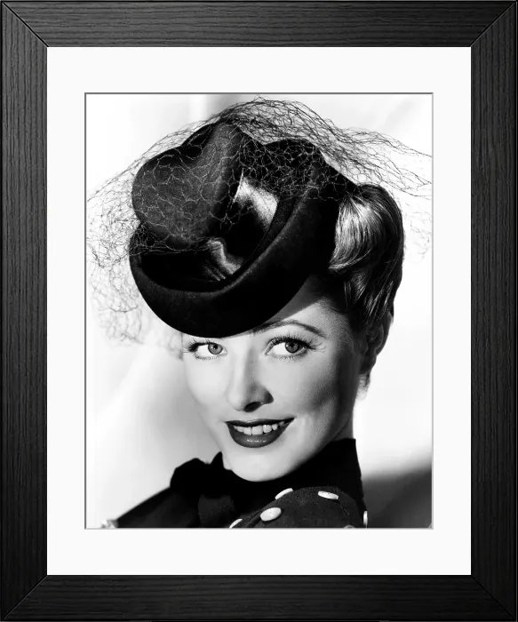 Framed Print : Eleanor Parker, modeling a felt hat with black satin trim, October 1943