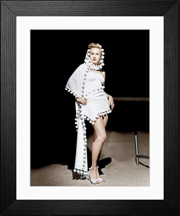 Framed Print : Virginia Mayo models a hooded stole over strapless one-piece bathing suit, 1948 Framed Print : Virginia Mayo models a hooded stole over strapless one-piece bathing suit, 1948