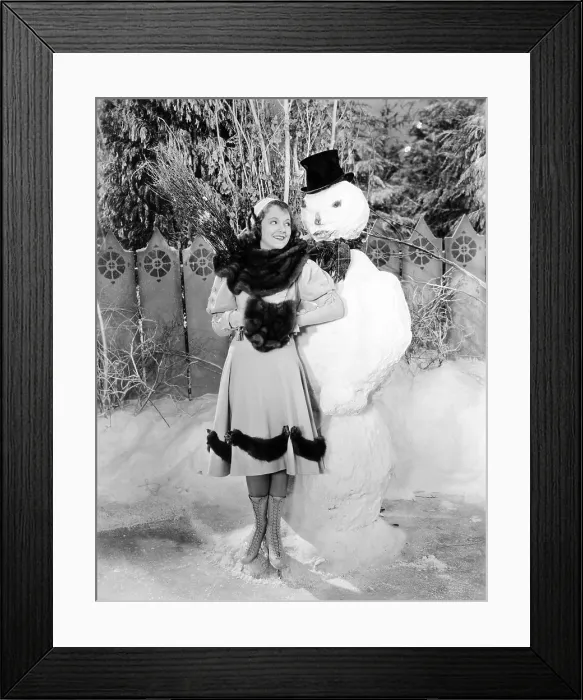 Framed Print : Janet Gaynor, cuddling up to a terrifying snowman, 1922 Framed Print : Janet Gaynor, cuddling up to a terrifying snowman, 1922
