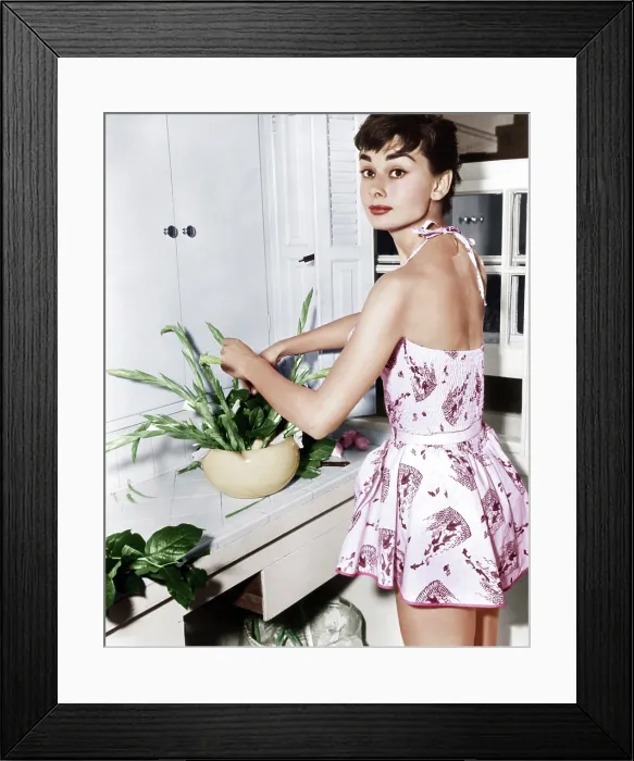 Framed Print : Audrey Hepburn creates a flower arrangement, ca. early 1950s Framed Print : Audrey Hepburn creates a flower arrangement, ca. early 1950s