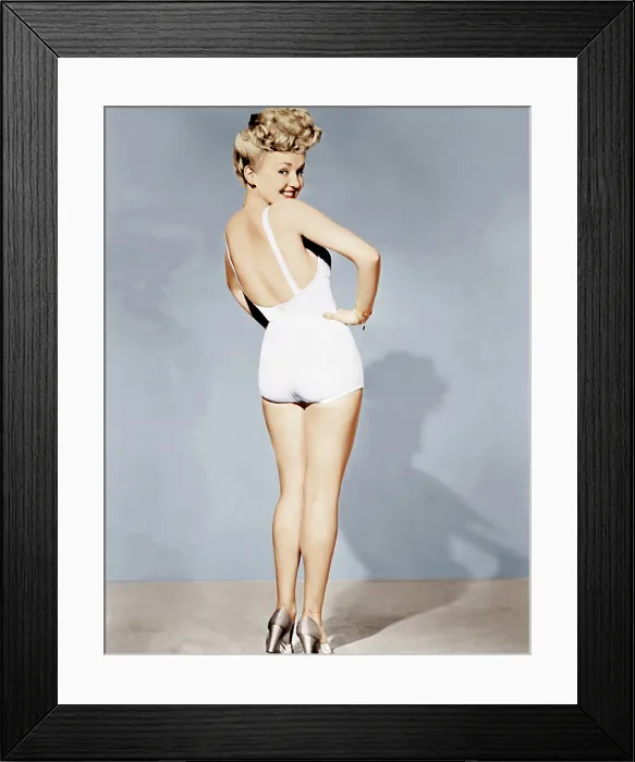 Framed Print : Betty Grable, in a pin-up pose taken by Frank Powolny in 1943 while filming SWEET ROSIE O'GRADY