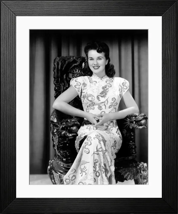 Framed Print : Deanna Durbin posing in costume used in AMAZING MRS. HOLLIDAY, 1943