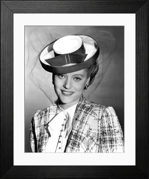 Framed Print : Alexis Smith, modeling a green and white tweed suit, with grosgrain-trimmed hat, summer 1943