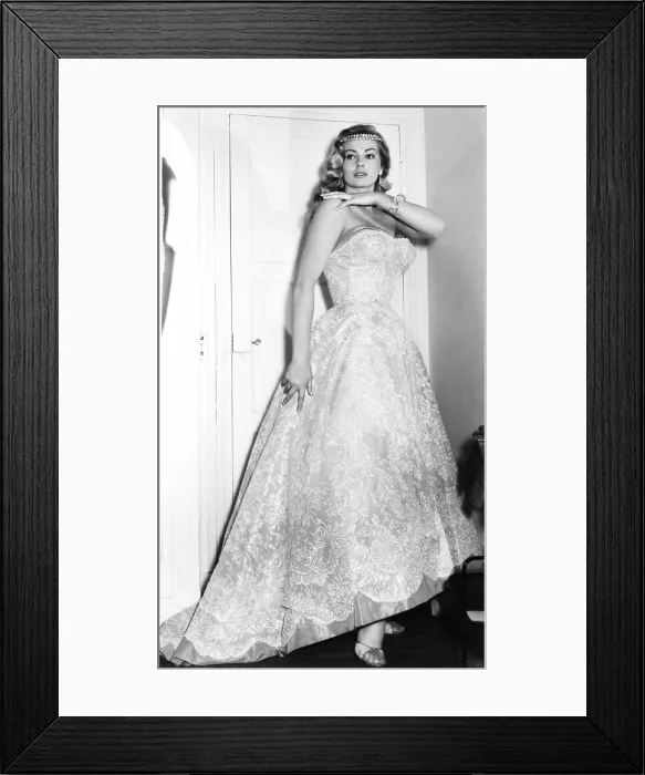 Framed Print : Anita Ekberg in a Pierre Balmain evening gown with diamond tiara, earings and bracelet by Van Cleef & Arpels, 1957