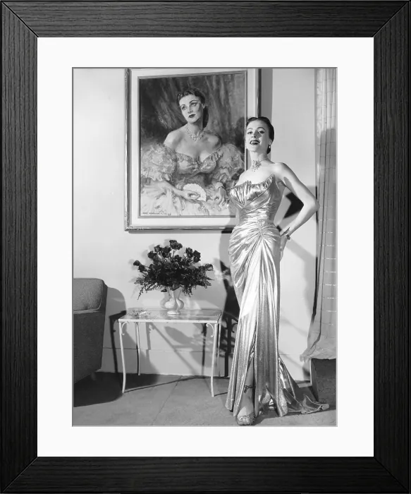 Framed Print : Anne Jeffreys, relaxing at home in a $2, 700 gown, 1953