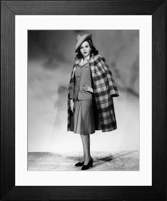 Framed Print : Ann Miller wearing light blue suit and plaid overcoat, 1941 Framed Print : Ann Miller wearing light blue suit and plaid overcoat, 1941