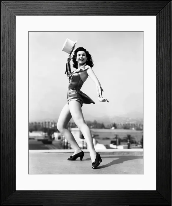 Framed Print : Ann Miller, rehearsing atop the Columbia sound stages for REVEILLE WITH BEVERLY, 1943