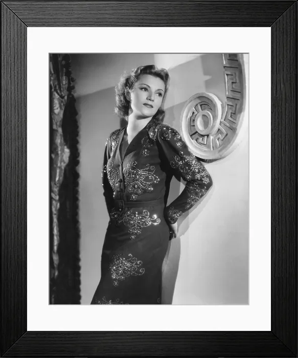Framed Print : Annabella, modeling a blue crepe and sequin dinner dress from her own wardrobe, 1939 Framed Print : Annabella, modeling a blue crepe and sequin dinner dress from her own wardrobe, 1939