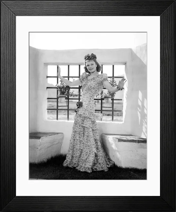 Framed Print : Anna Neagle, modeling a fuschia and white cotton evening gown with blue ribbon bows, 1940 Framed Print : Anna Neagle, modeling a fuschia and white cotton evening gown with blue ribbon bows, 1940