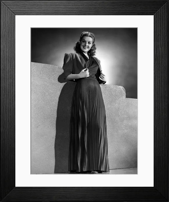Framed Print : Ann Sheridan wearing pleated evening gown designed by Nate King, 1940
