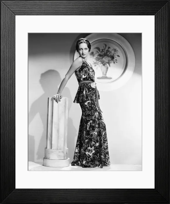 Framed Print : Dorothy Lamour, modeling a crepe floral evening frock with a leather belt, 1936