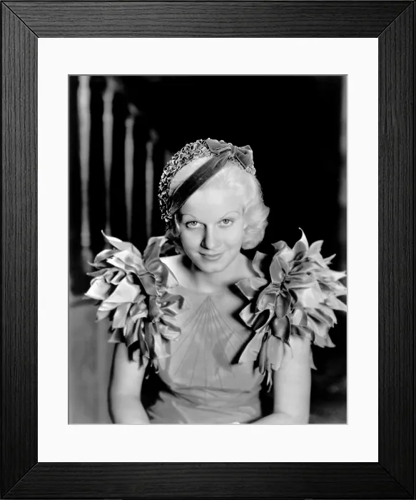 Framed Print : Jean Harlow, modeling a blue taffeta frock and velvet hat, 1933