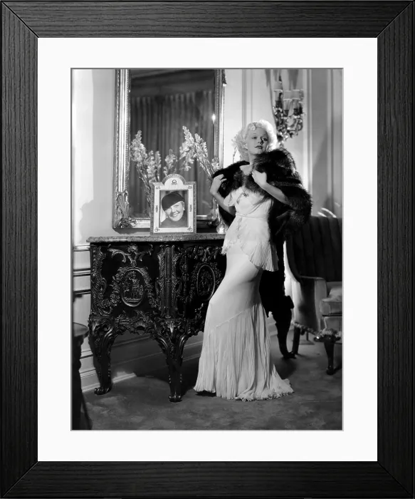 Framed Print : Jean Harlow with photograph of her mother, Jean, ca. early-mid 1930s Framed Print : Jean Harlow with photograph of her mother, Jean, ca. early-mid 1930s