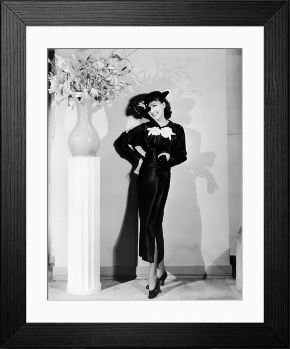 Framed Print : Jean Parker, modeling a collegienne frock of black satin with a split skirt and white satin flowers, ca. mid-1930s Framed Print : Jean Parker, modeling a collegienne frock of black satin with a split skirt and white satin flowers, ca. mid-1930s