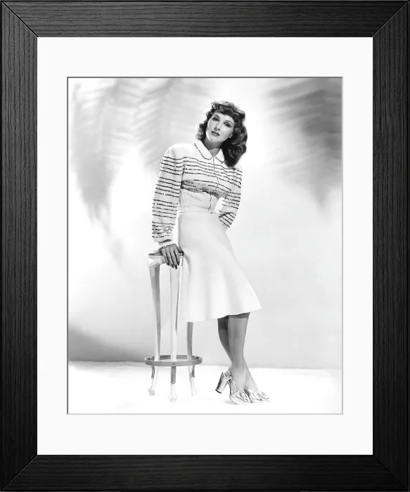 Framed Print : Jean Parker, modeling a wool dress with a gold-sequined bodice and gold leather sandals, 1941 Framed Print : Jean Parker, modeling a wool dress with a gold-sequined bodice and gold leather sandals, 1941