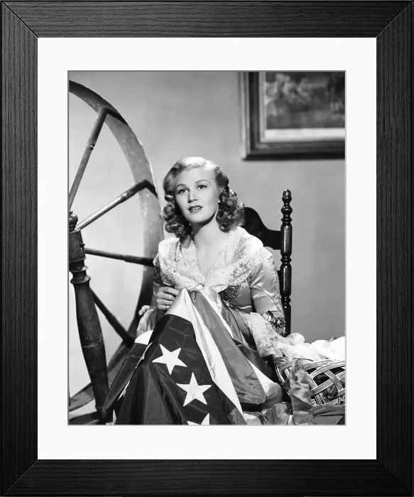 Framed Print : Joan Caulfield as Betsy Ross, sewing the American flag, in celebration of the Fourth of July, Paramount portrait by Bud Fraker, 1947