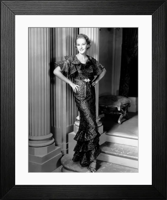 Framed Print : Phyllis Brooks, modeling a brown lace dress with gold embroidery, 1935