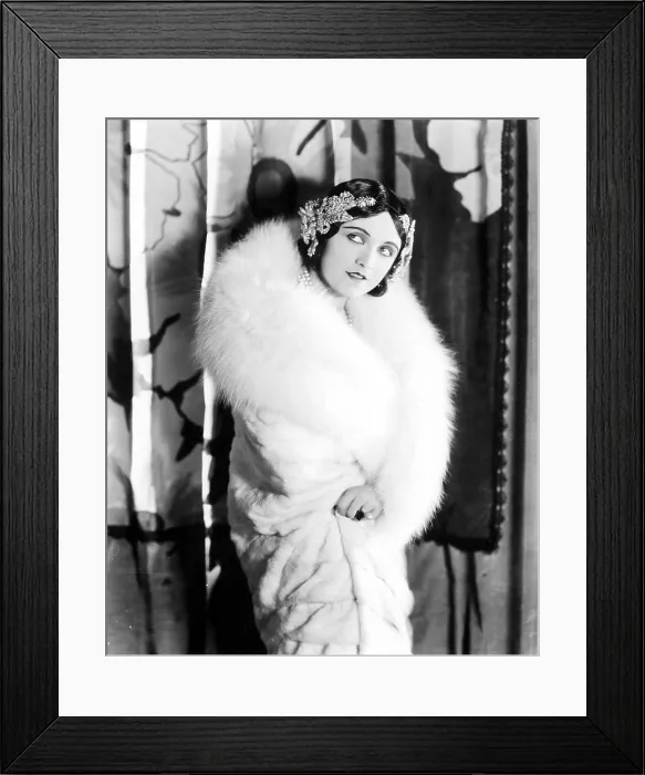 Framed Print : POLA NEGRI wearing a white knee-length fur Llate, late 1920s
