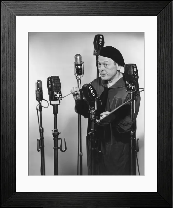 Framed Print : Artist Fred Allen painting the NBCs on the network microphones, 1940s