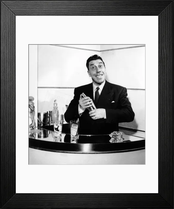 Framed Print : Fernandel, mixing a cocktail at his home bar after work, 1958 Framed Print : Fernandel, mixing a cocktail at his home bar after work, 1958