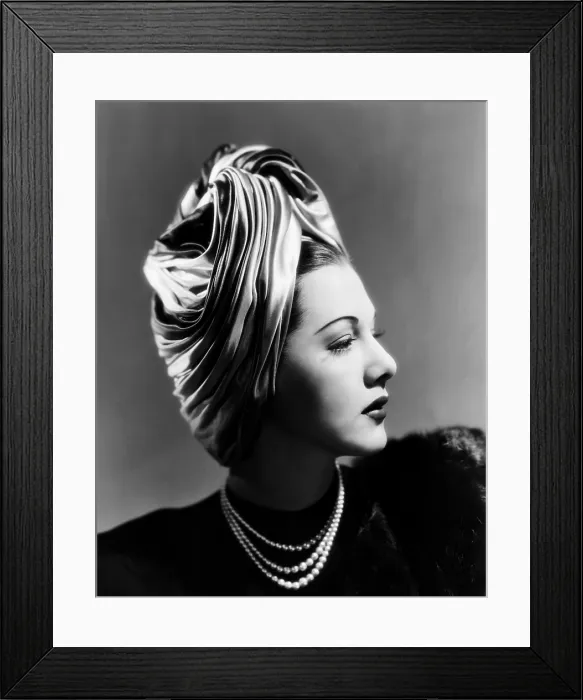 Framed Print : Maria Montez, modeling a Lilly Dache turban of pink, blue and green satin, 1945 Framed Print : Maria Montez, modeling a Lilly Dache turban of pink, blue and green satin, 1945