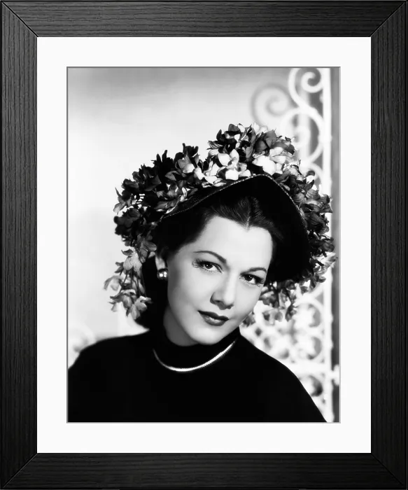 Framed Print : Maria Montez, modeling a violet-colored straw bonnet trimmed with violets, 1946