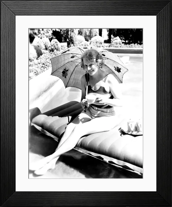 Framed Print : Minna Gombell, sipping a cup of tea poolside, 1931 Framed Print : Minna Gombell, sipping a cup of tea poolside, 1931