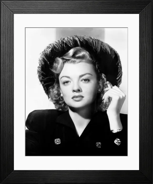 Framed Print : Myrna Dell, modeling a black felt hat trimmed with brown pheasant feathers, 1948 Framed Print : Myrna Dell, modeling a black felt hat trimmed with brown pheasant feathers, 1948