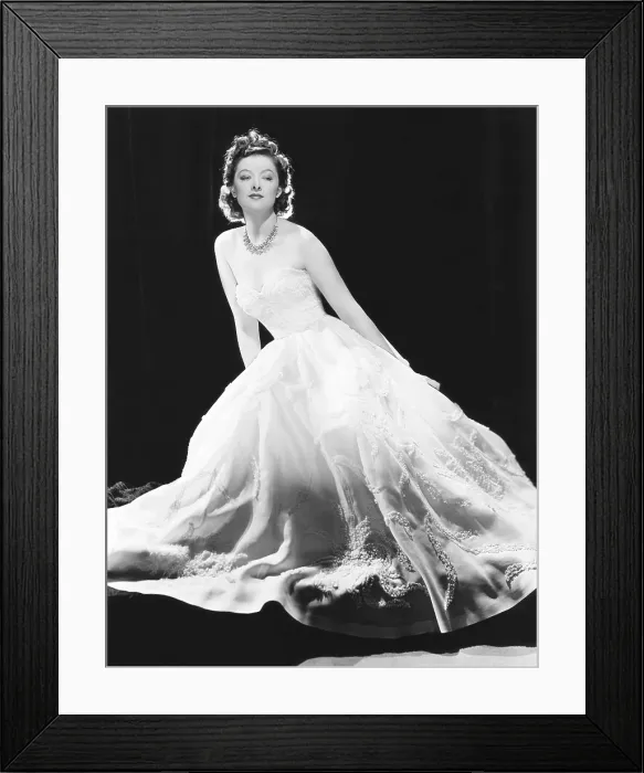 Framed Print : Myrna Loy in a white souffle evening gown with a diamond and silver necklace in a starfish pattern, MGM portrait, circa 1940 Framed Print : Myrna Loy in a white souffle evening gown with a diamond and silver necklace in a starfish pattern, MGM portrait, circa 1940