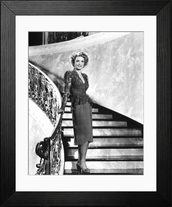 Framed Print : Natalie Schafer, modeling a cocktail suit of gray lace and crepe, 1944