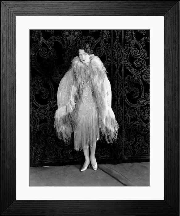 Framed Print : Norma Shearer, modeling a panne-velvet evening wrap embroidered in crystals and trimmed in ostrich feathers, 1927