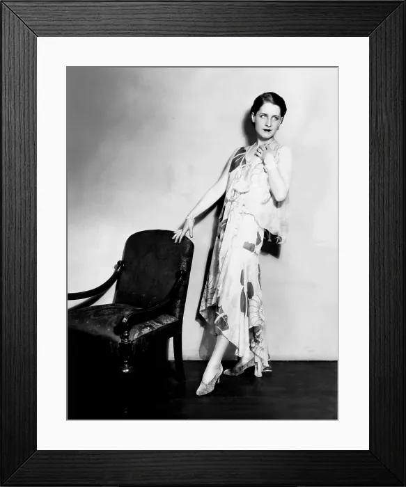 Framed Print : Norma Shearer, modeling a chiffon evening frock with an uneven hemline, 1929