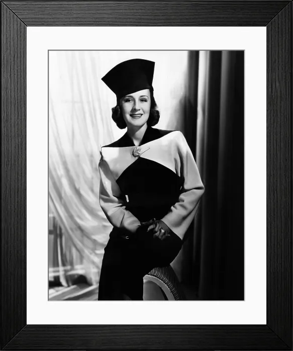 Framed Print : Norma Shearer, modeling a black and white fall suit, 1938