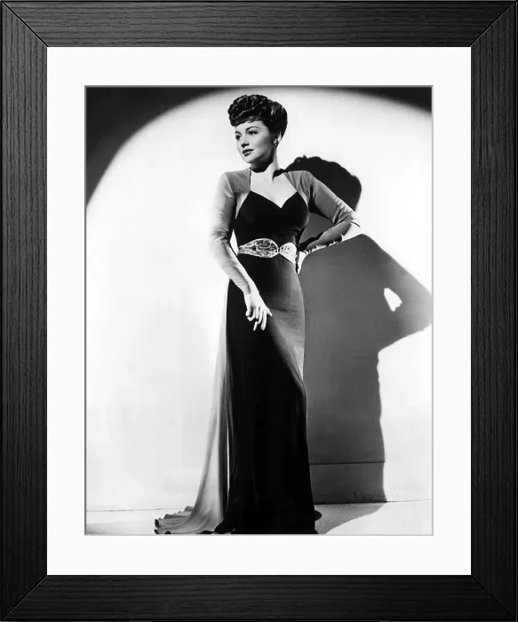 Framed Print : Olivia De Havilland in a black crepe evening gown, 1941