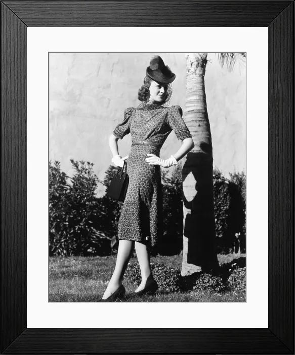Framed Print : Olivia de Havilland, modeling an afternoon dress of red, white and blue, with a straw hat, spring 1939 Framed Print : Olivia de Havilland, modeling an afternoon dress of red, white and blue, with a straw hat, spring 1939