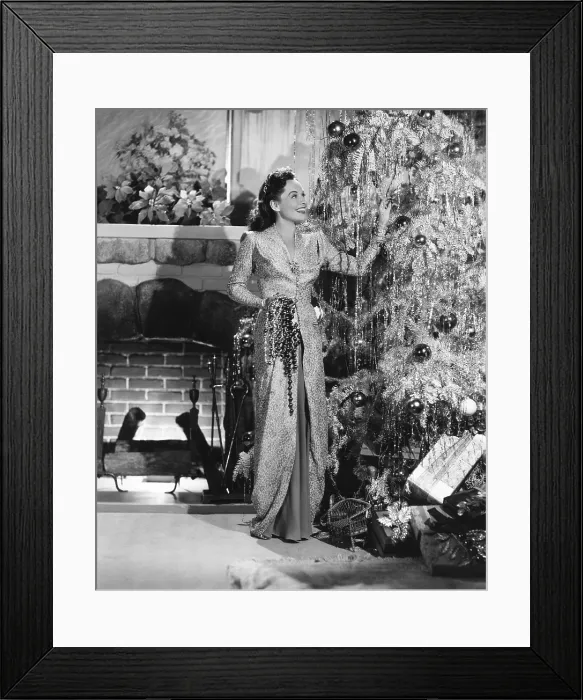 Framed Print : Paulette Goddard decorating her Christmas tree, 1940 Framed Print : Paulette Goddard decorating her Christmas tree, 1940