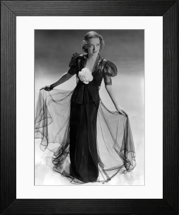 Framed Print : Bette Davis wearing black taffeta gown with black lace bolero jacket, ca. 1937 Framed Print : Bette Davis wearing black taffeta gown with black lace bolero jacket, ca. 1937