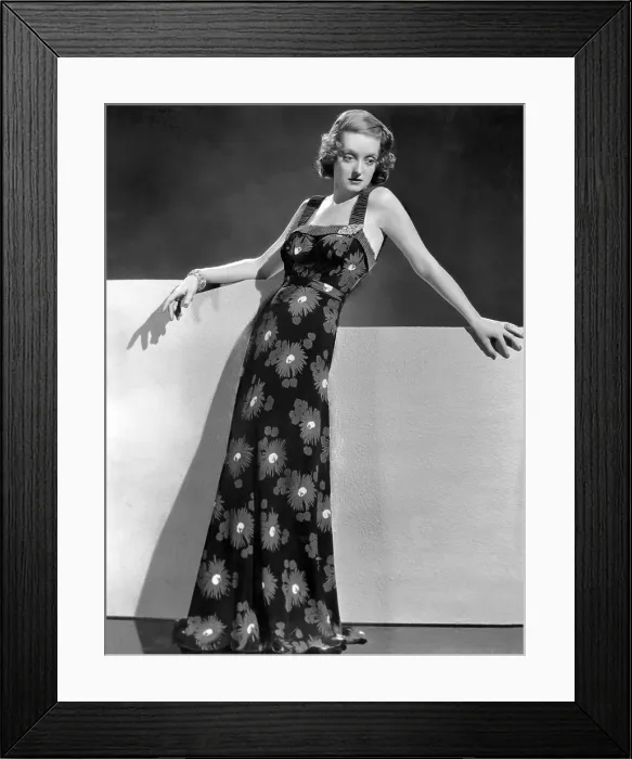 Framed Print : Bette Davis wearing crepe yellow and green print gown, ca. 1937 Framed Print : Bette Davis wearing crepe yellow and green print gown, ca. 1937