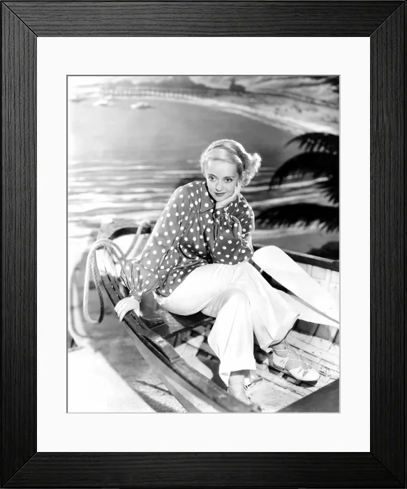 Framed Print : Bette Davis, modeling a red and white beach ensemble, 1935