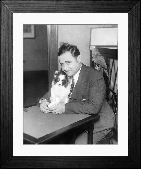 Framed Print : Beniamino Gigli with his dog Aida and parrot, around 1927 Framed Print : Beniamino Gigli with his dog Aida and parrot, around 1927