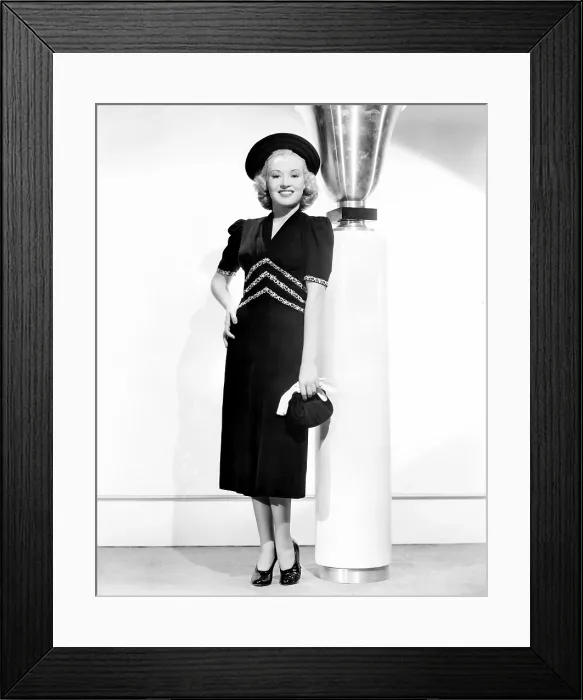 Framed Print : Betty Grable, modeling a black crepe spring frock trimmed with white embroidery, 1938 Framed Print : Betty Grable, modeling a black crepe spring frock trimmed with white embroidery, 1938