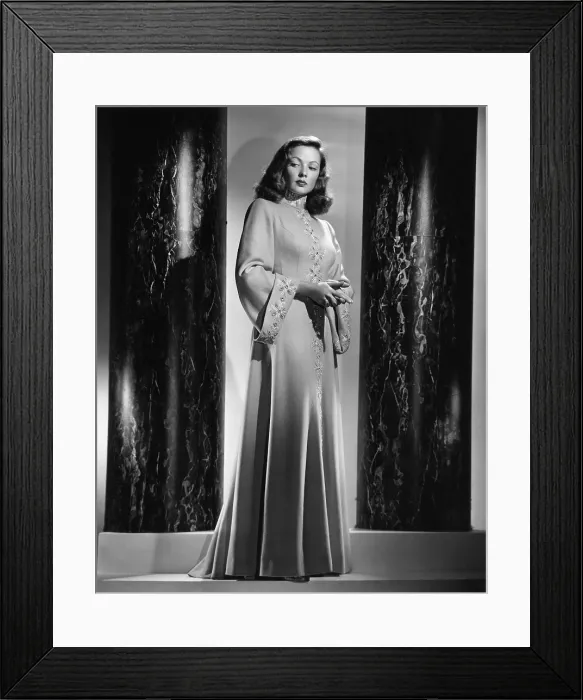 Framed Print : Gene Tierney models an apricot wool evening coat with gold, turquoise and crystal trimming, 1946