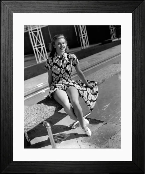 Framed Print : GINGER ROGERS, in a publicity portrait at her home for RKO, c. 1938