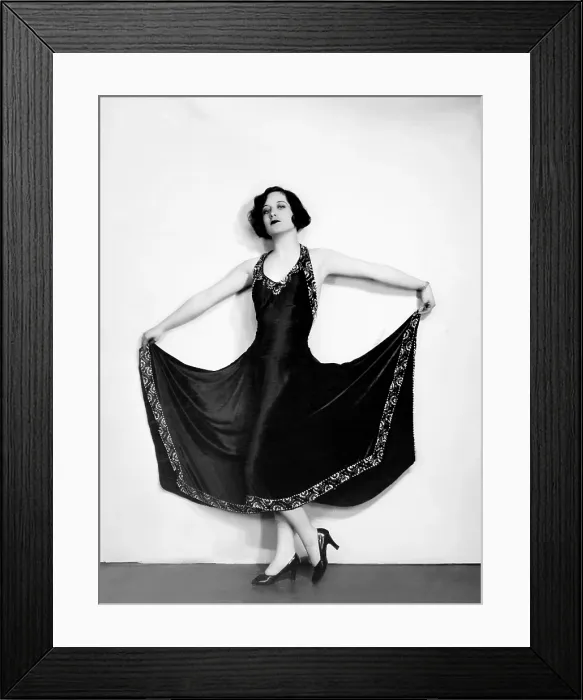 Framed Print : Joan Crawford, in a black satin gown trimmed with silver beads, ca. 1926 Framed Print : Joan Crawford, in a black satin gown trimmed with silver beads, ca. 1926