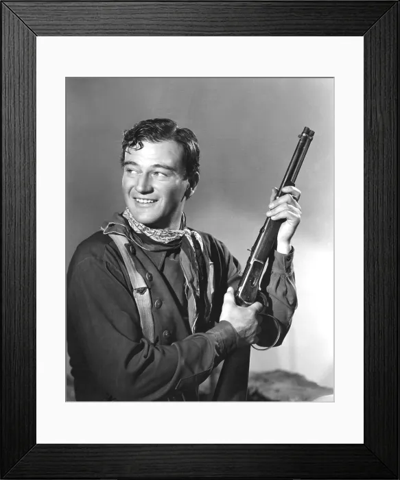 Framed Print : John Wayne in costume for STAGECOACH, 1939 TM and Copyright (c) 20th Century Fox Film Corp. All rights reserved. Courtesy: Everett Collection'