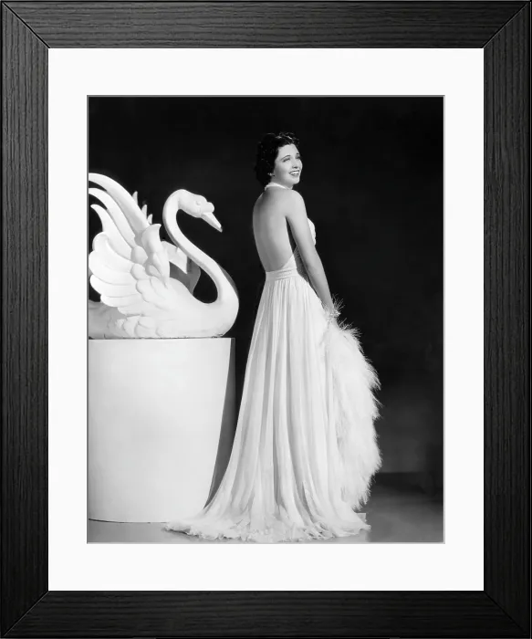 Framed Print : Kay Francis modeling white chiffon evening gown, 1937