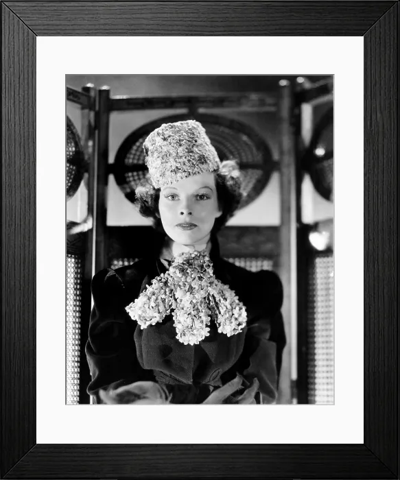 Framed Print : Katharine Hepburn, modeling a hat and bib made of tiny flowers, 1936 Framed Print : Katharine Hepburn, modeling a hat and bib made of tiny flowers, 1936