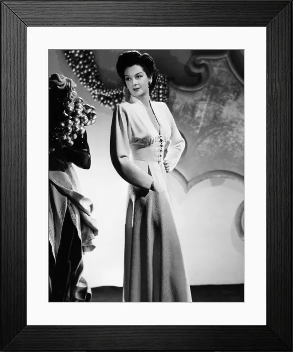 Framed Print : Rosalind Russell in a v-neckline dinner dress designed by Adrian, 1941